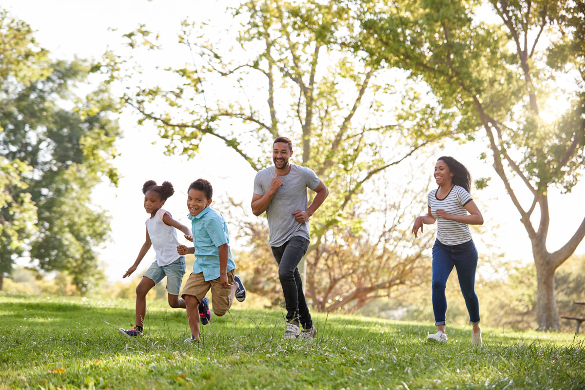 Family running in a field