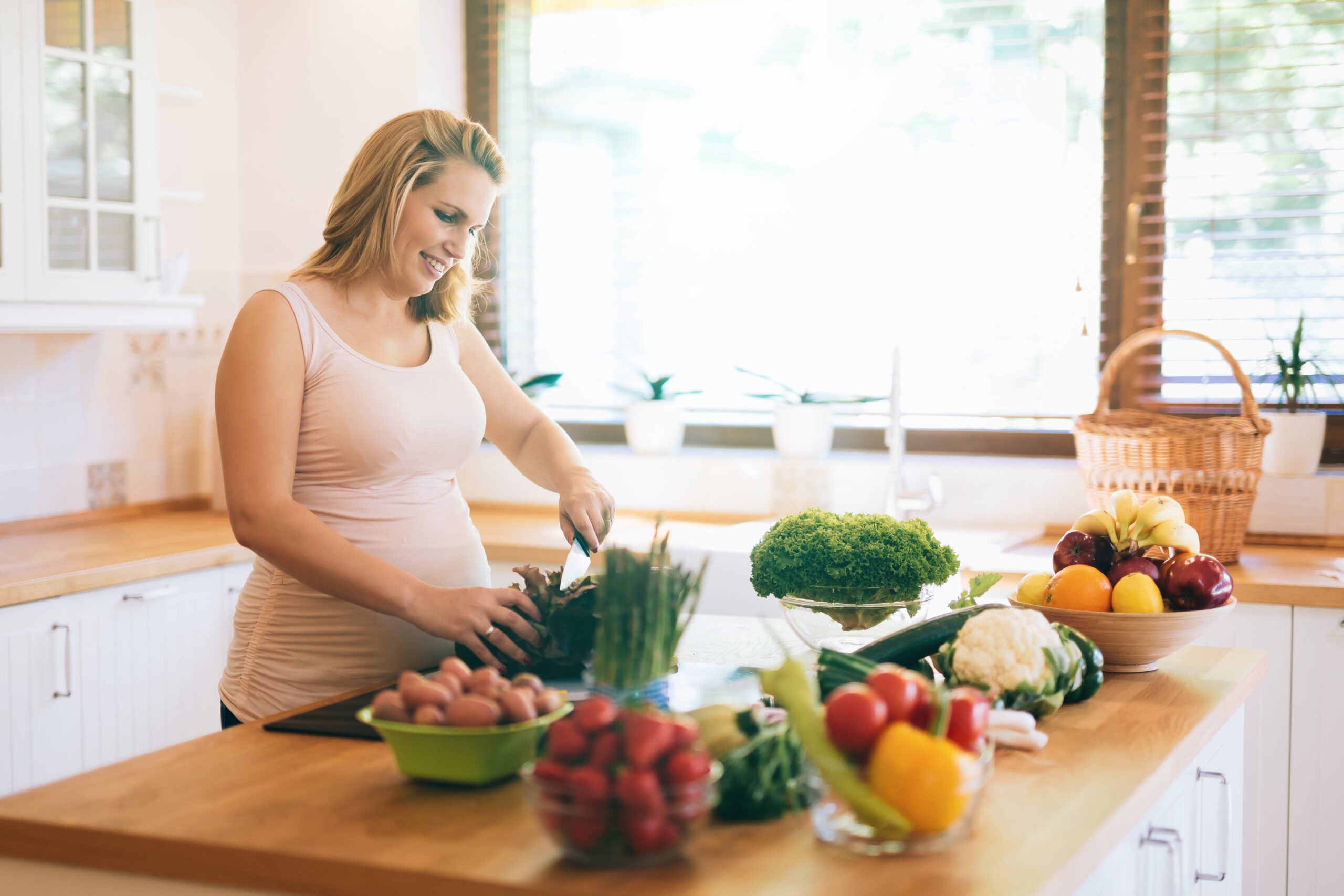 Pregnant woman preparing a meal